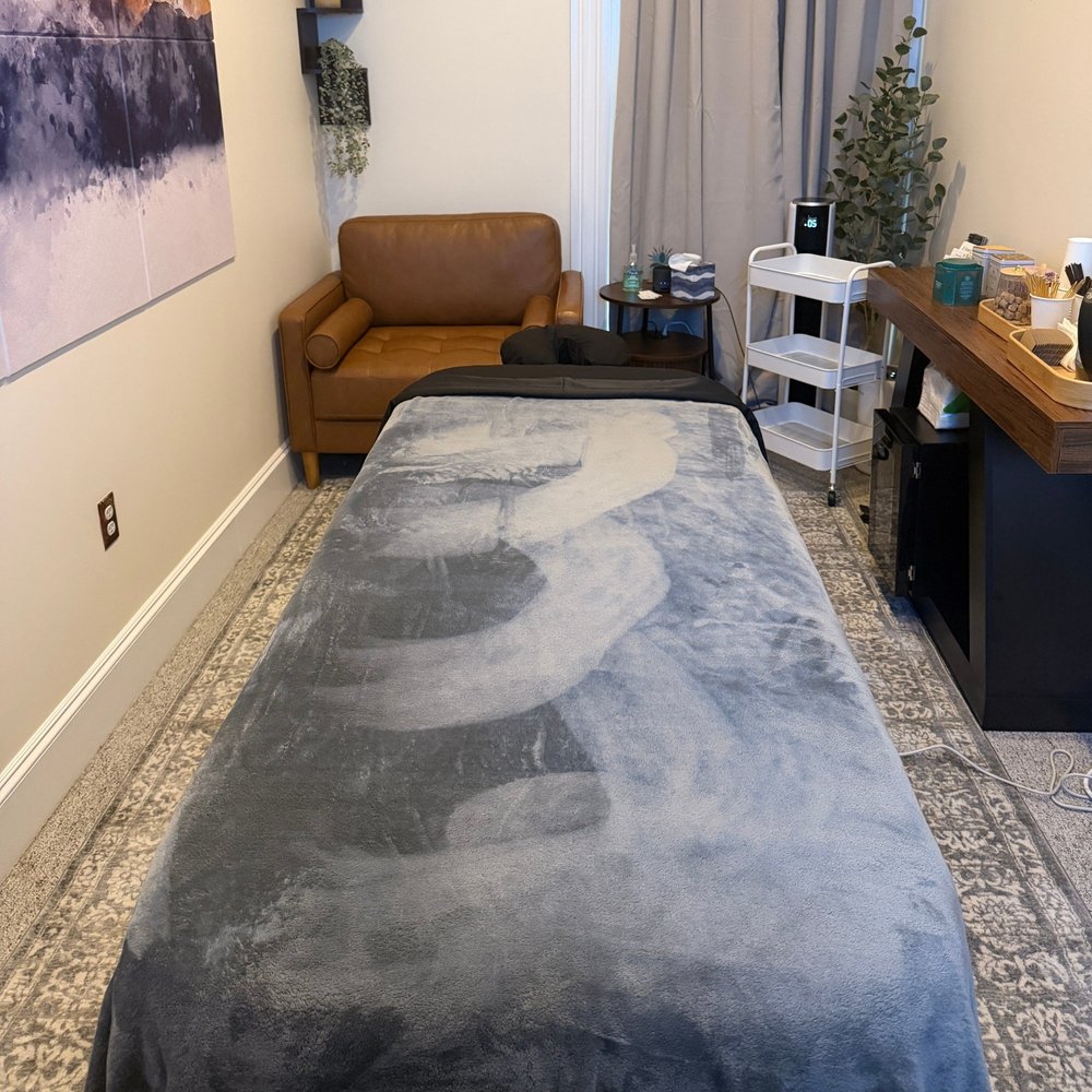 The massage table and seating in Revivo’s Arlington studio